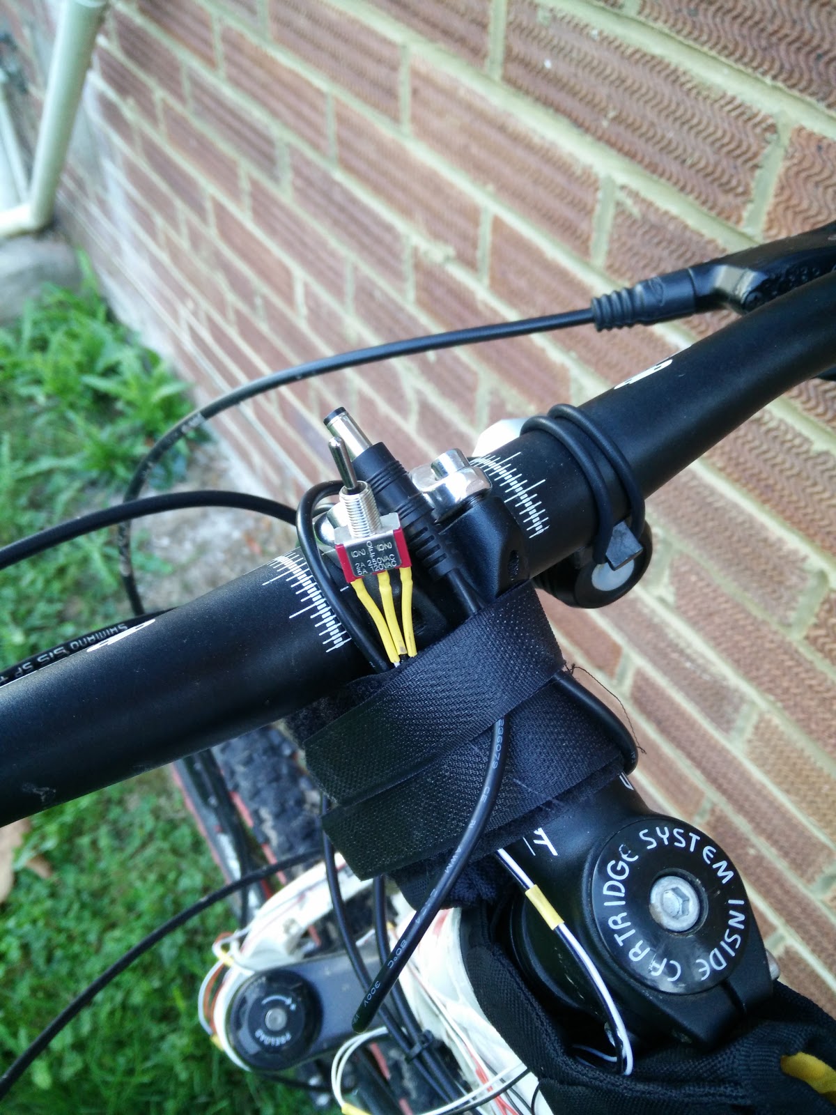 Handily, my main bike like battery was velcro'ed on here, so it provided a convenient way to attach it in an accessible place